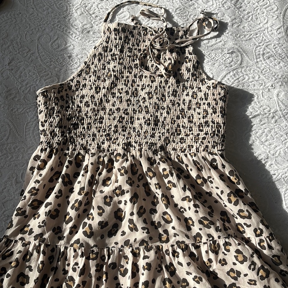 Pattern dress. Color is very light pink, and it has brown tones. Only used once!